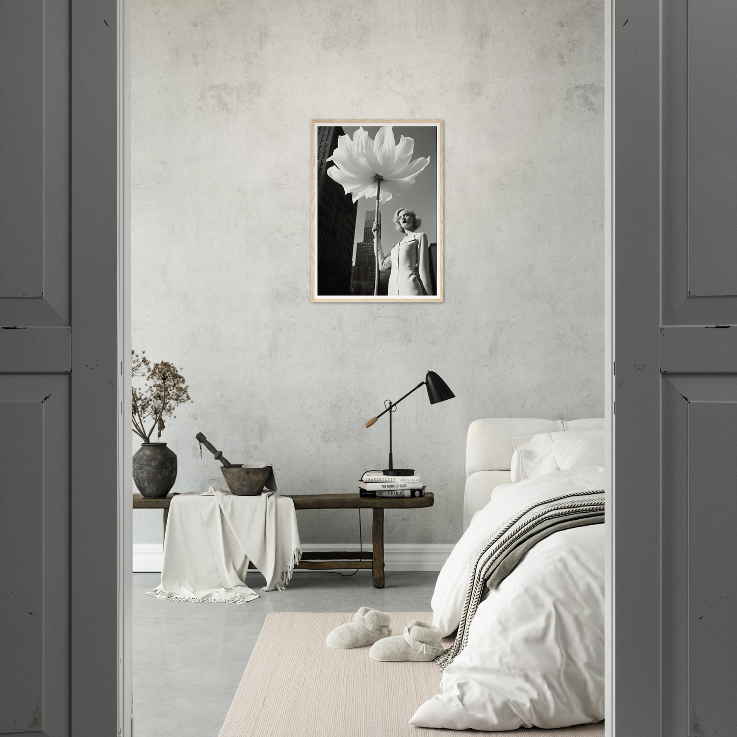 A white flower in a room with a grey wall