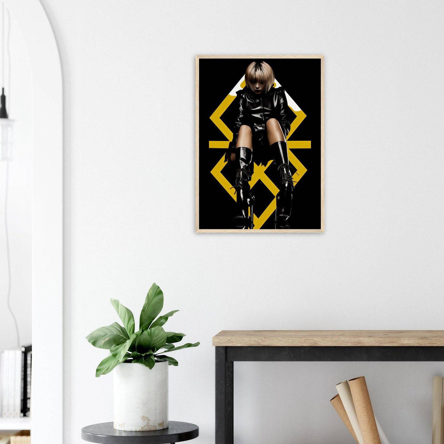 Framed poster featuring a person in black clothing posing dramatically against a dark background with yellow geometric shapes.