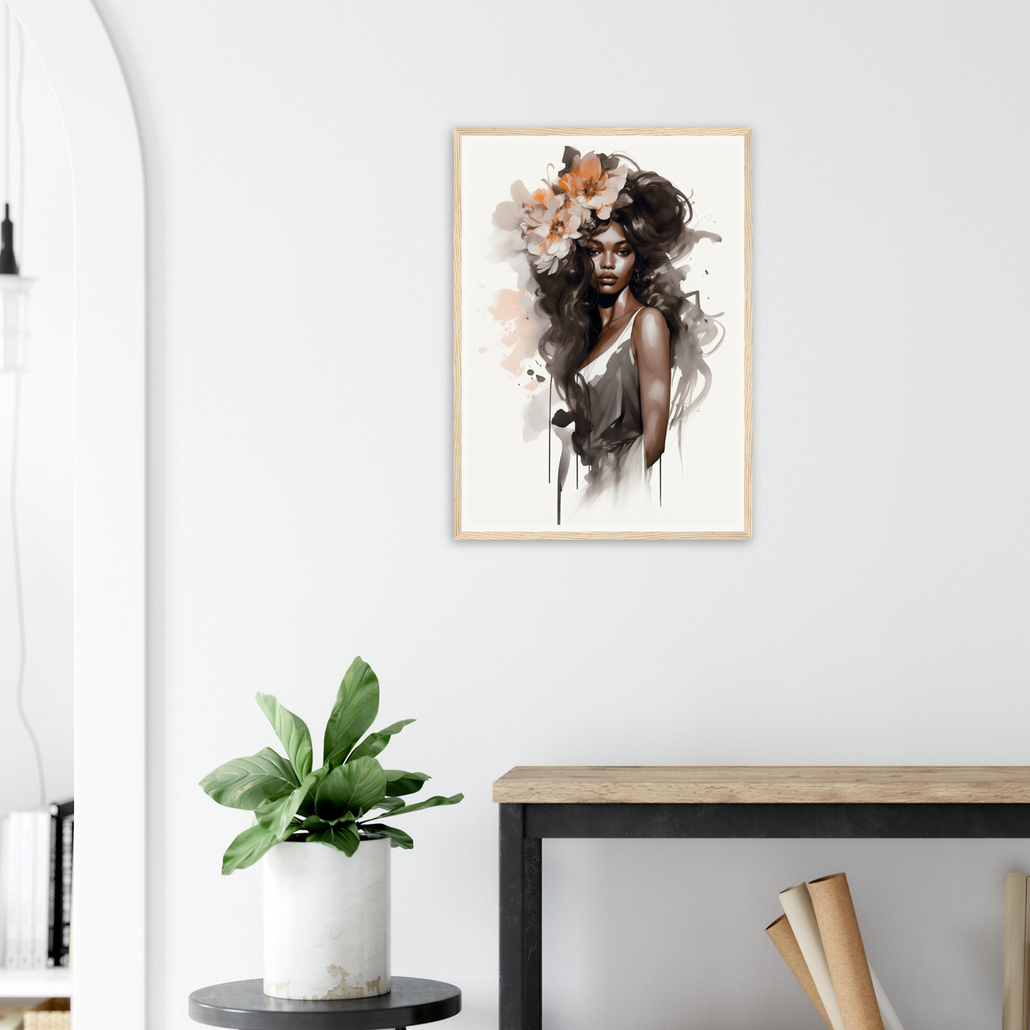 Artistic portrait of a woman with abstract watercolor-style elements framed on a wall.
