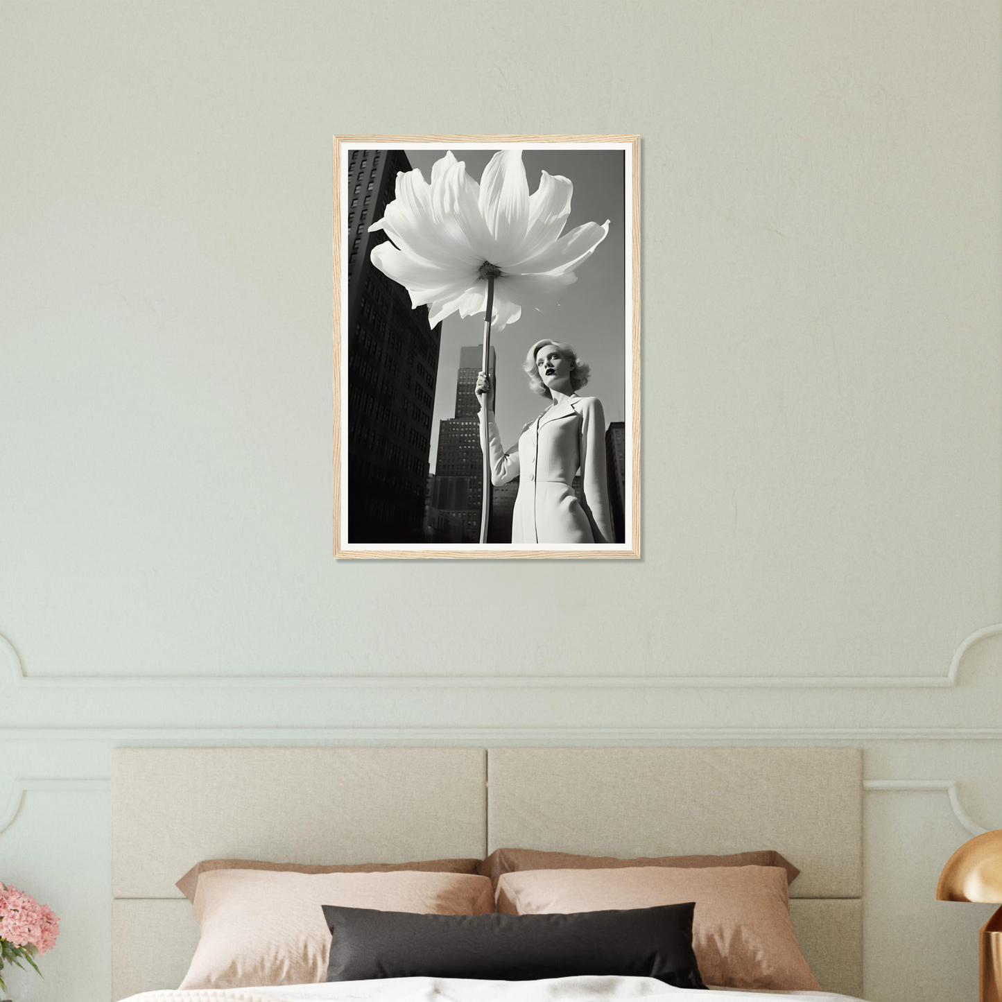 A woman holding a large white flower in her hand