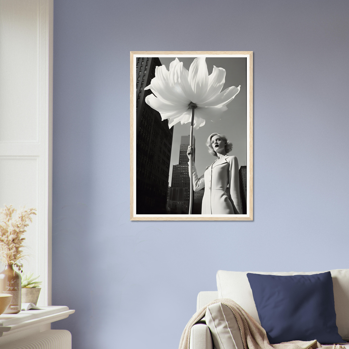 A woman holding a large white flower in her hand