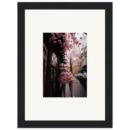 Framed wall art of pink cherry blossoms over a city for Petal Eccentricity Revealed