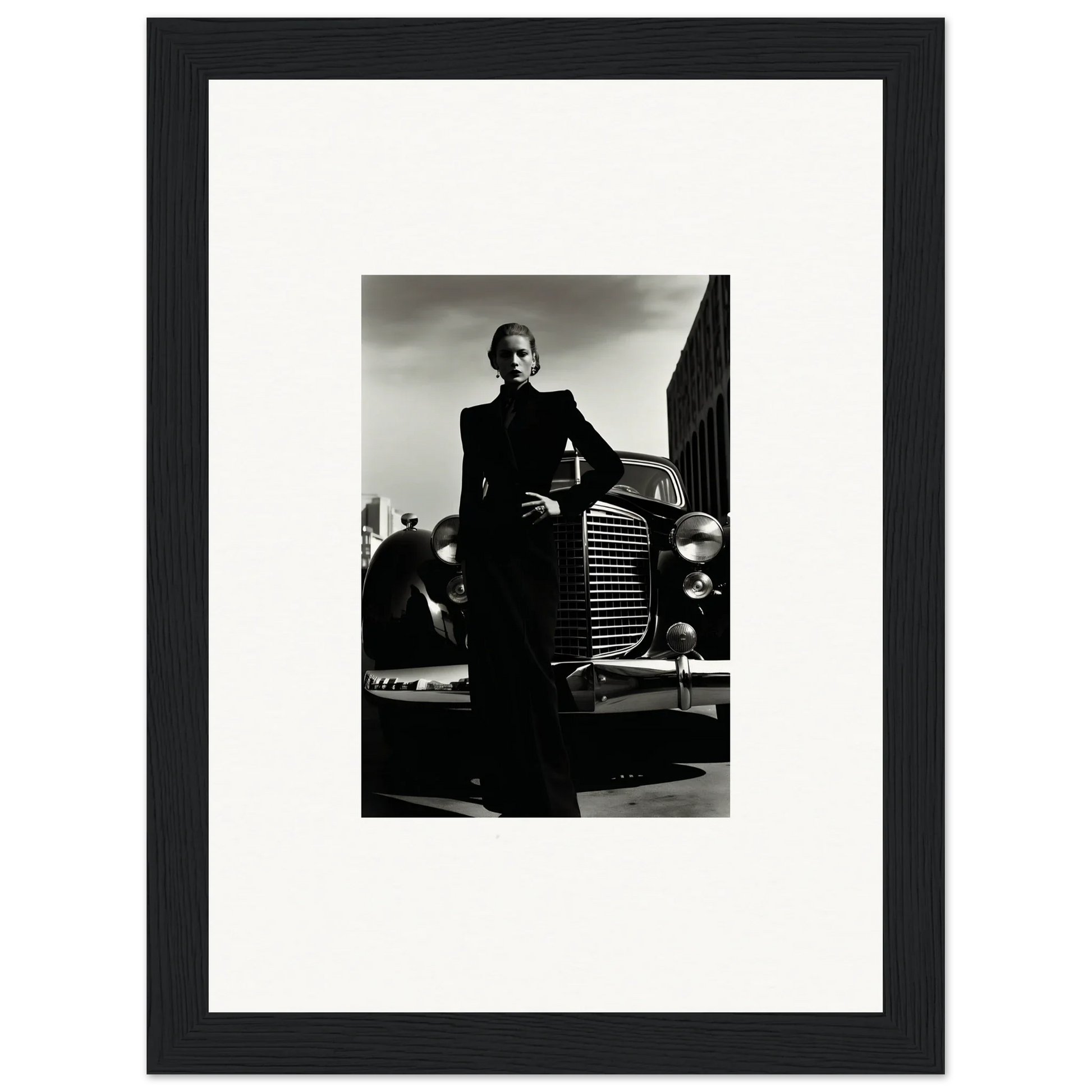 Black and white shot of someone in formal wear next to a vintage car for Noiray Vogue Explosion