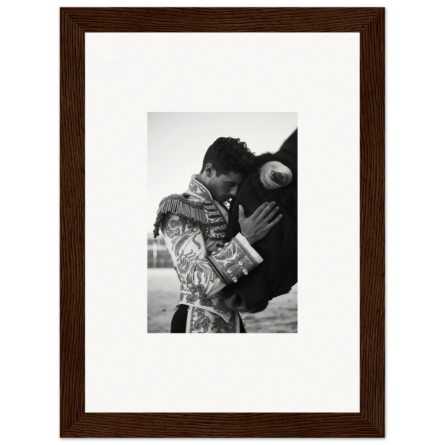 Framed black and white photo of a matador in embroidered outfit from Triumphant Shadows Embrace