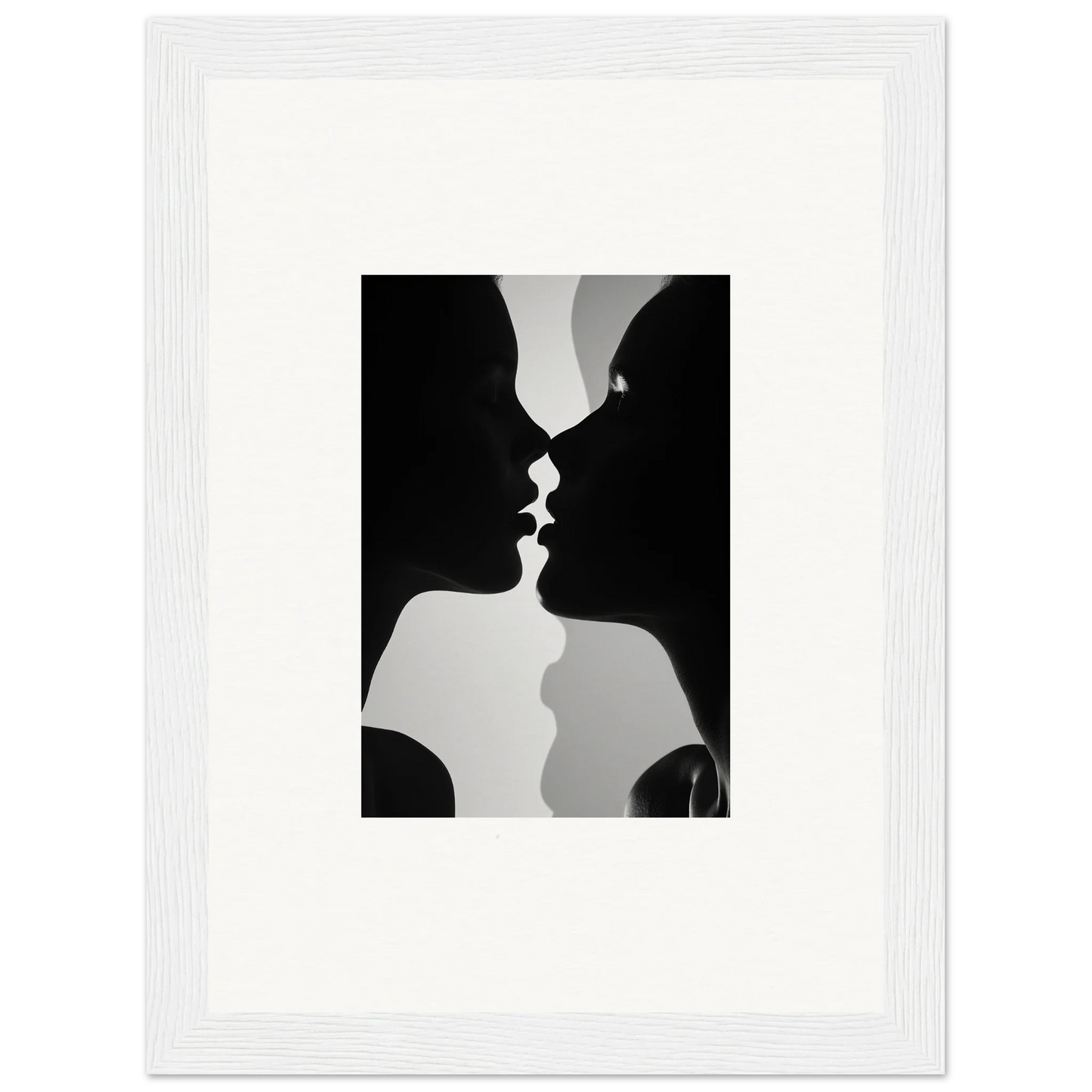 Black and white silhouette of two profiles about to kiss in Nouveau Love Symphony framed wall art