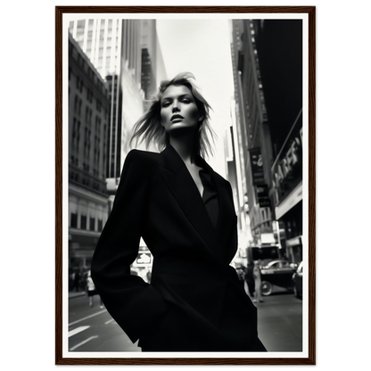 Woman in a black coat standing on a city street.