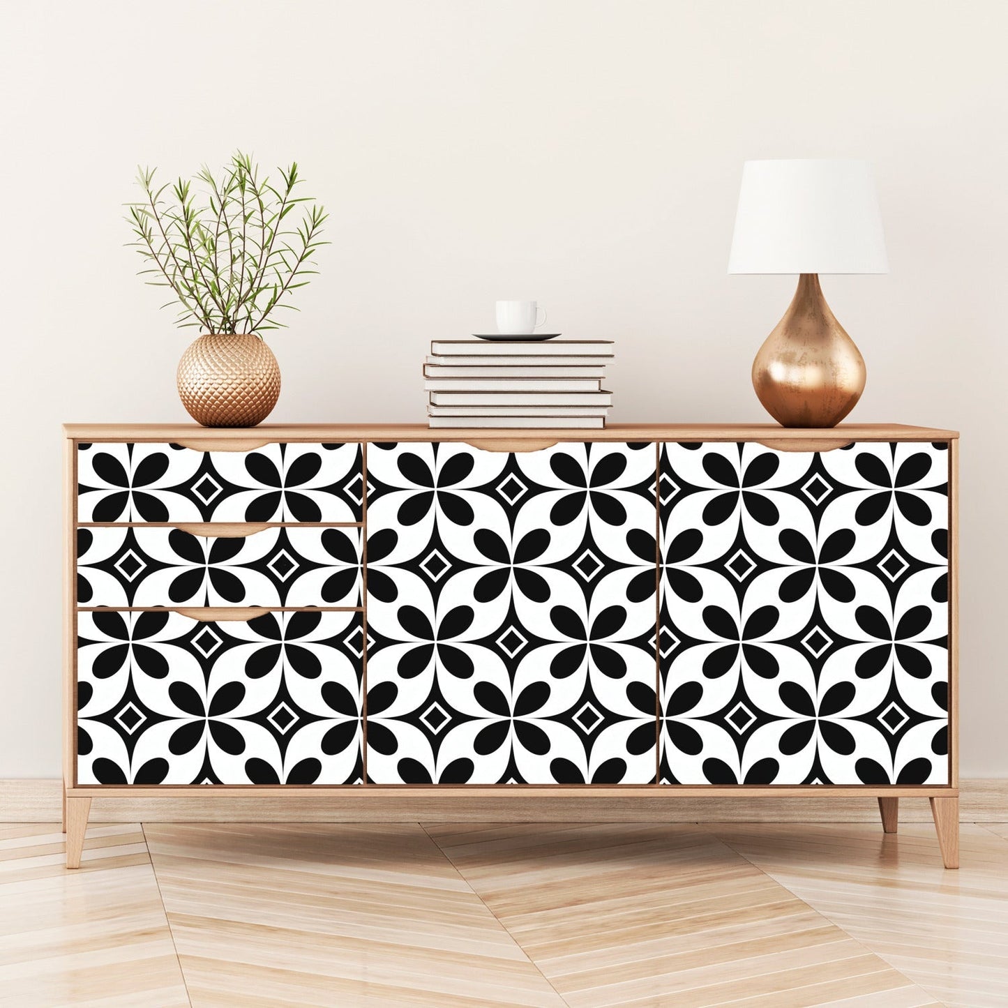 Wooden sideboard with black and white geometric patterned doors.