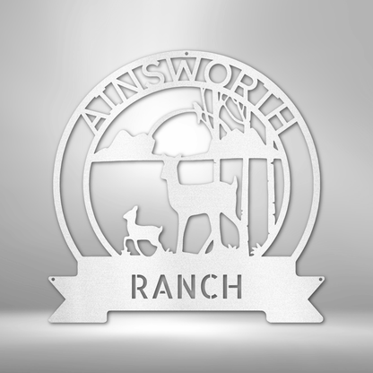 Circular logo design for ’Ainsworth Ranch’ featuring silhouettes of deer and trees.