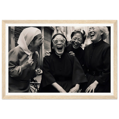 Black and white photograph of four women laughing joyfully together.