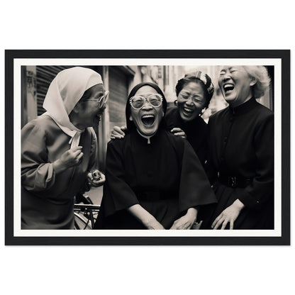 Black and white photograph of four women laughing joyfully together.