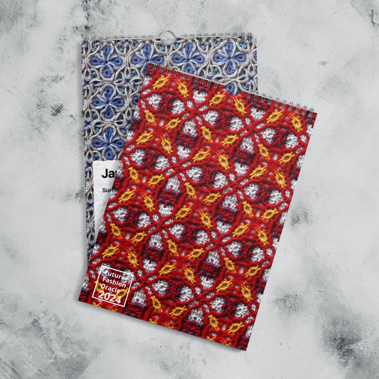 Two patterned notebooks or journals, one with a blue floral design and the other with a red floral design.