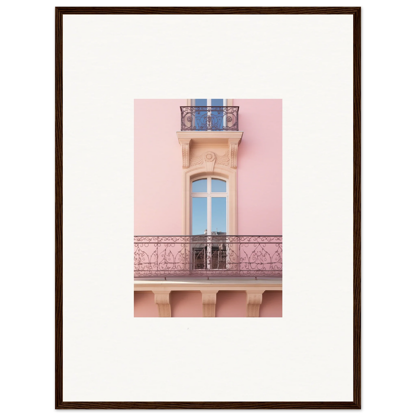 Elegant French balcony with ornate ironwork on a pink building, featuring Dusky Dream Balustrade