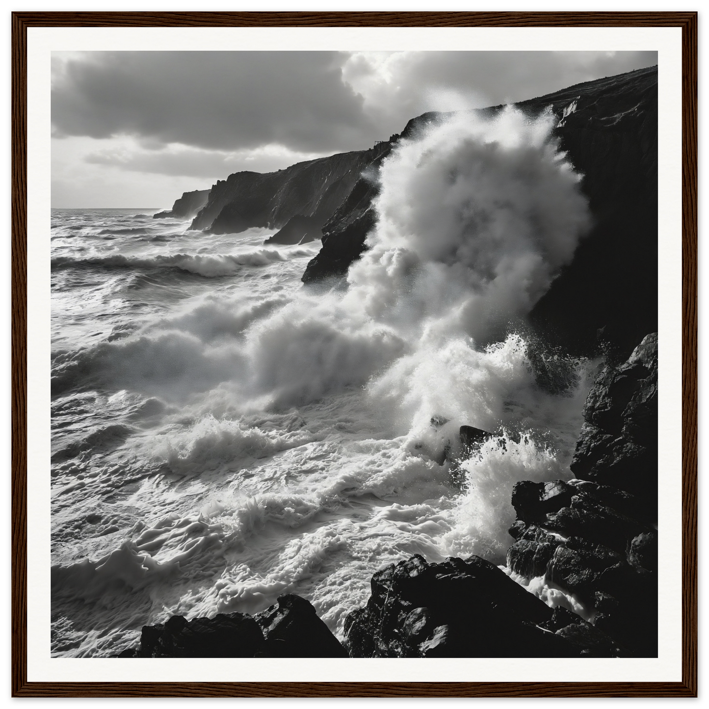 Powerful ocean waves crash on cliffs in black and white for Ocean’s Untamed Poems