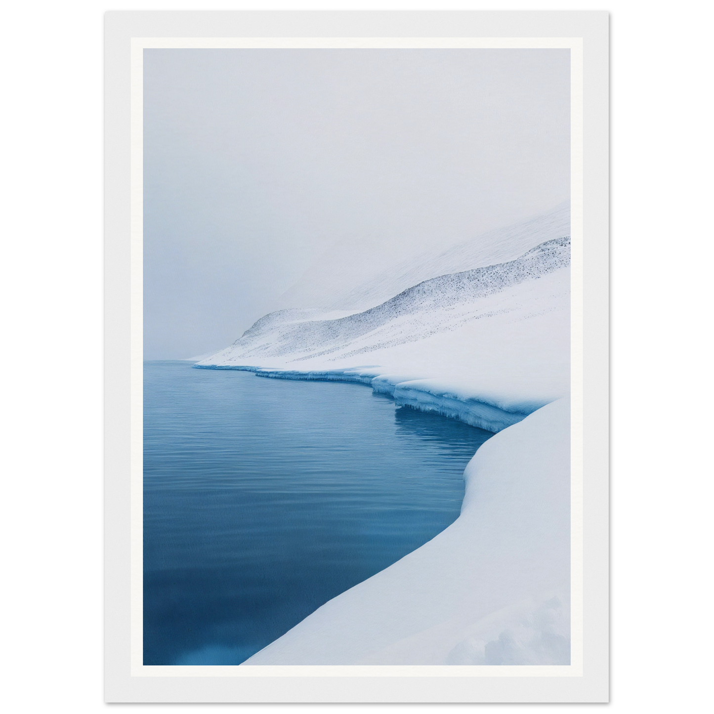 Framed wall art of a snowy landscape with icy shores and calm blue water.