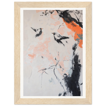 Framed wall art of two birds flying near a tree with orange and pink blossoms.