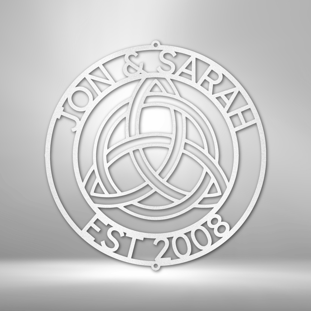 Circular emblem featuring a Celtic trinity knot design with text ’JON & SARAH EST 2008’’ around the perimeter.