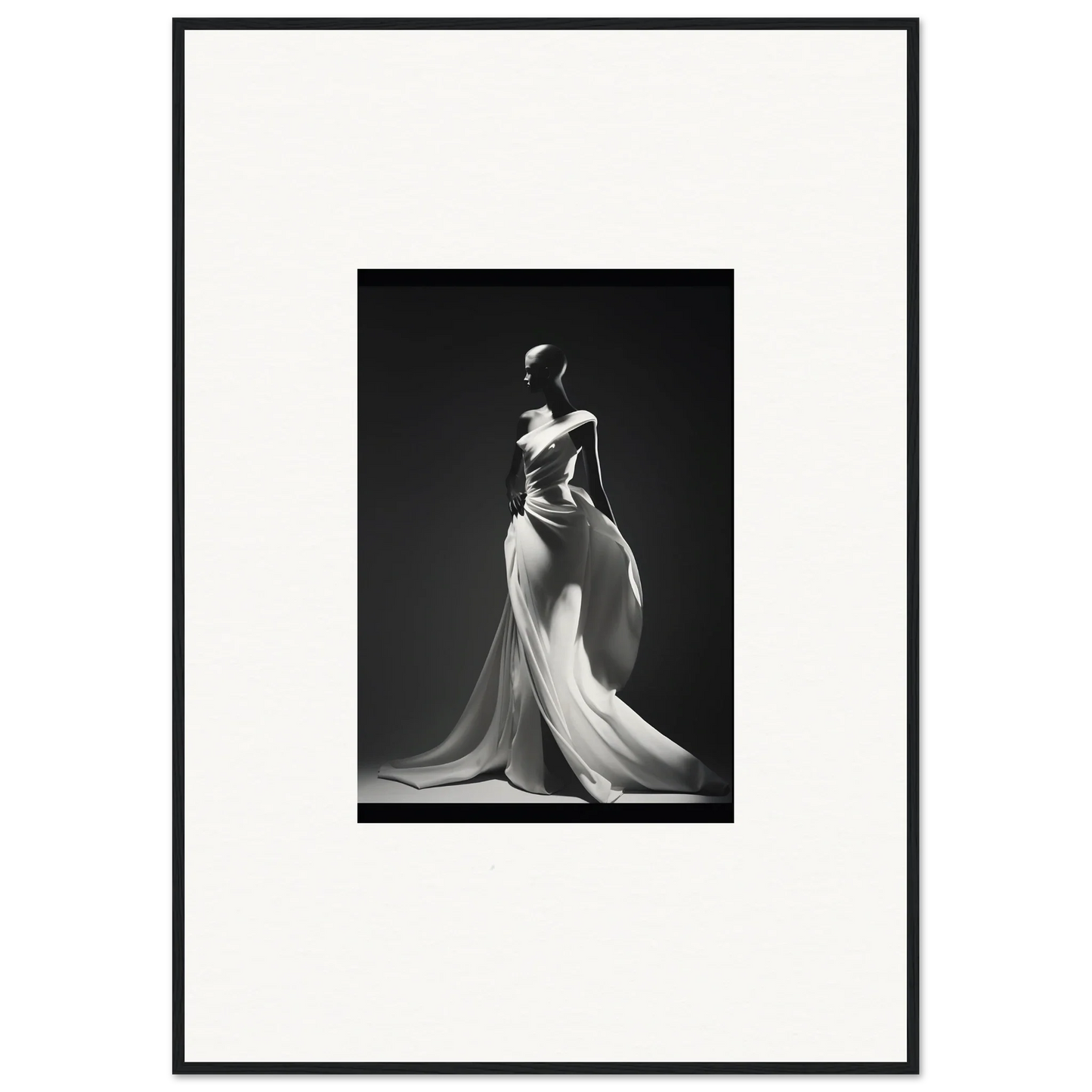 Elegant black and white photo of a figure in a Gossamer Ivory Whispers gown