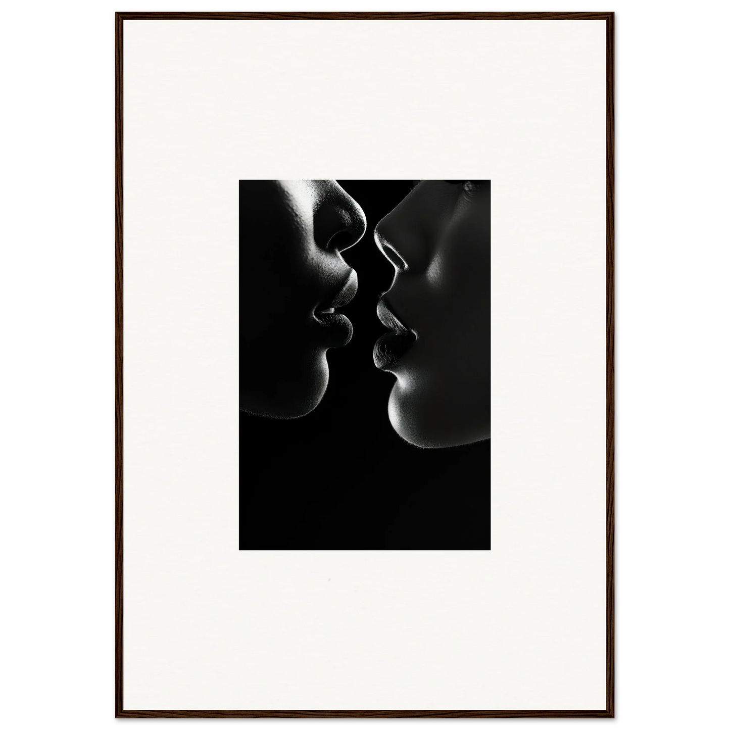 Silhouetted profiles set to kiss in dramatic black and white for Midnight Kiss Darkness