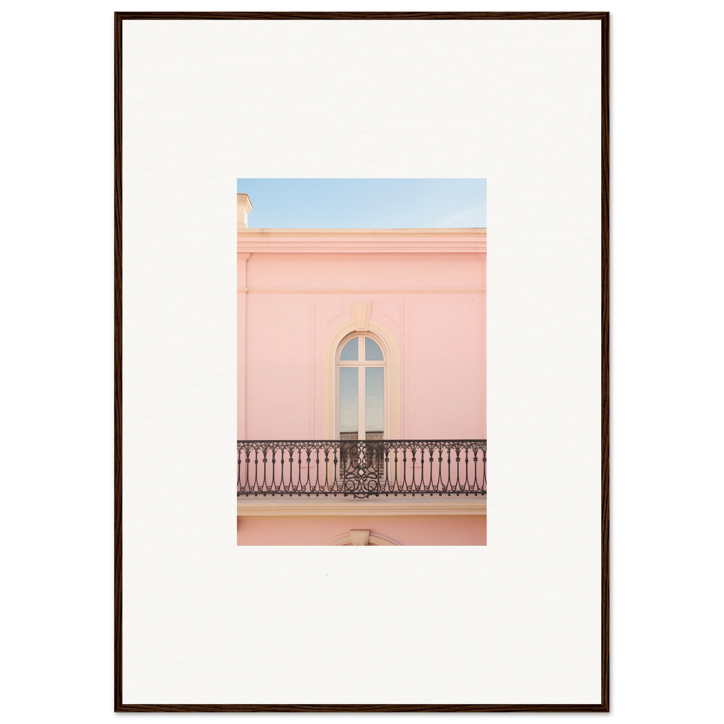 Arched window with a decorative iron balcony on a pink wall in Peach Tranquil Portal