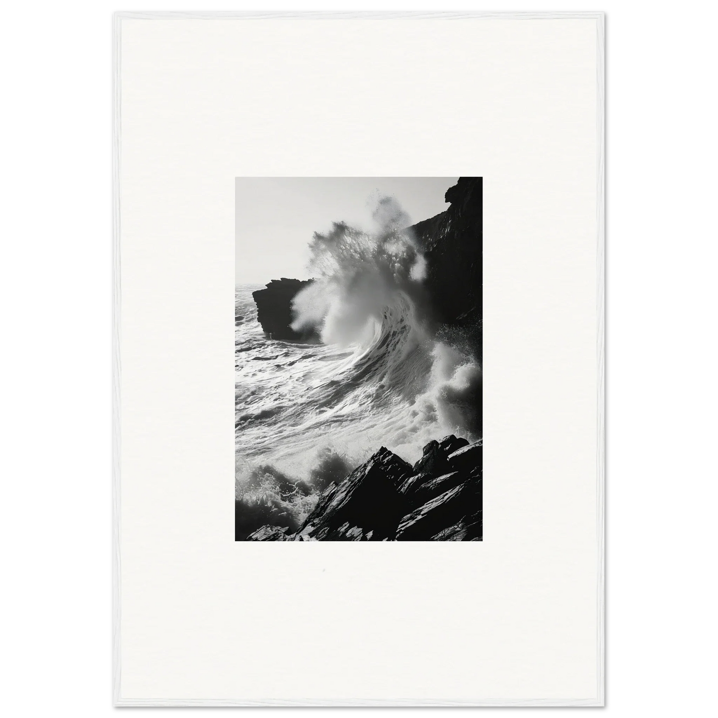 Powerful black and white ocean wave crashing on cliffs in the Incandescent Wave Tribute