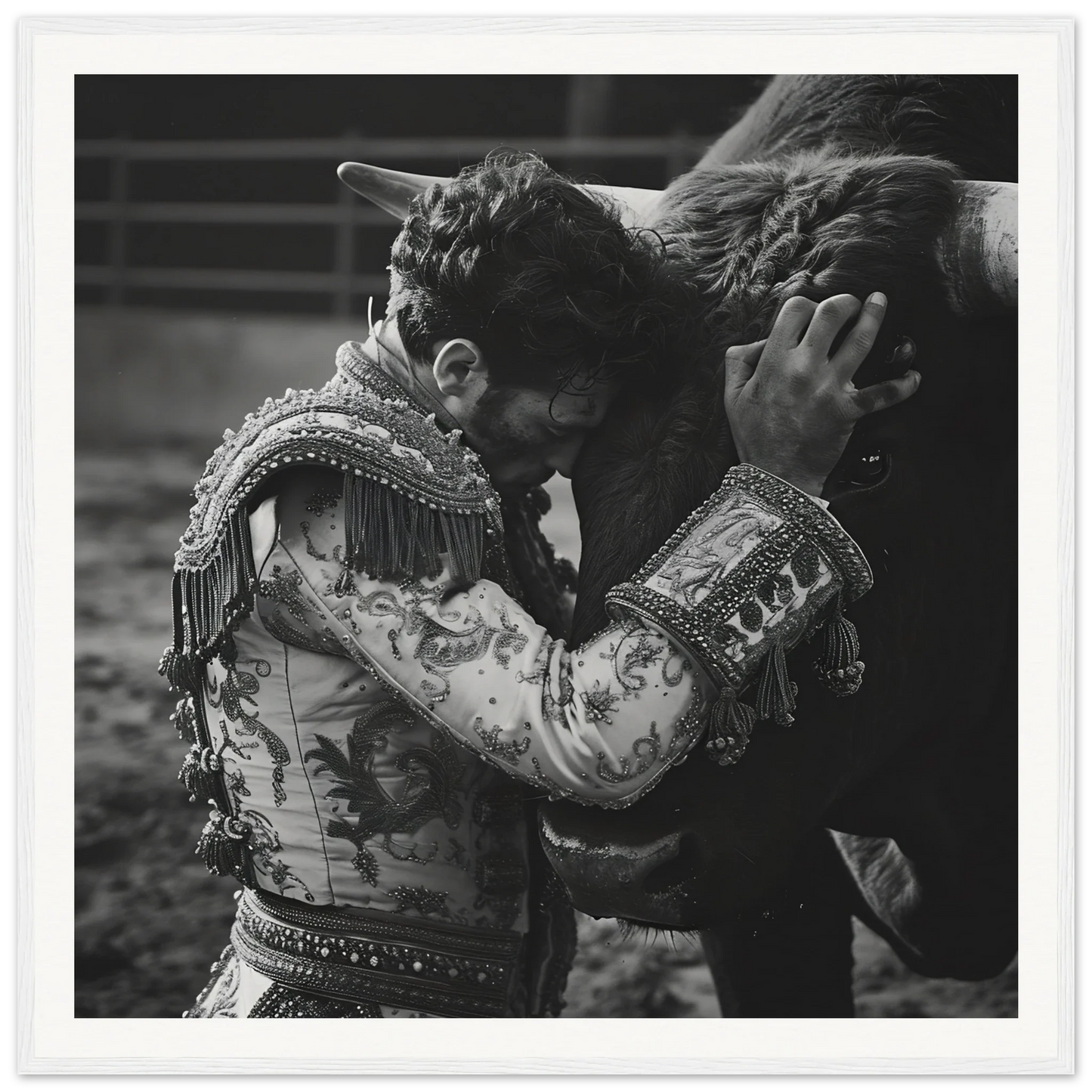 Bullfighter in ornate jacket embracing a bull in Graceful Reverie Duet framed poster