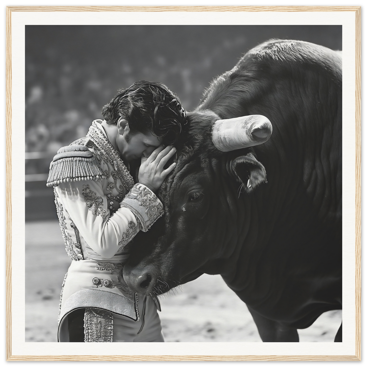 Matador in ornate uniform gently pressing head against bull, framed wall art special edition art™