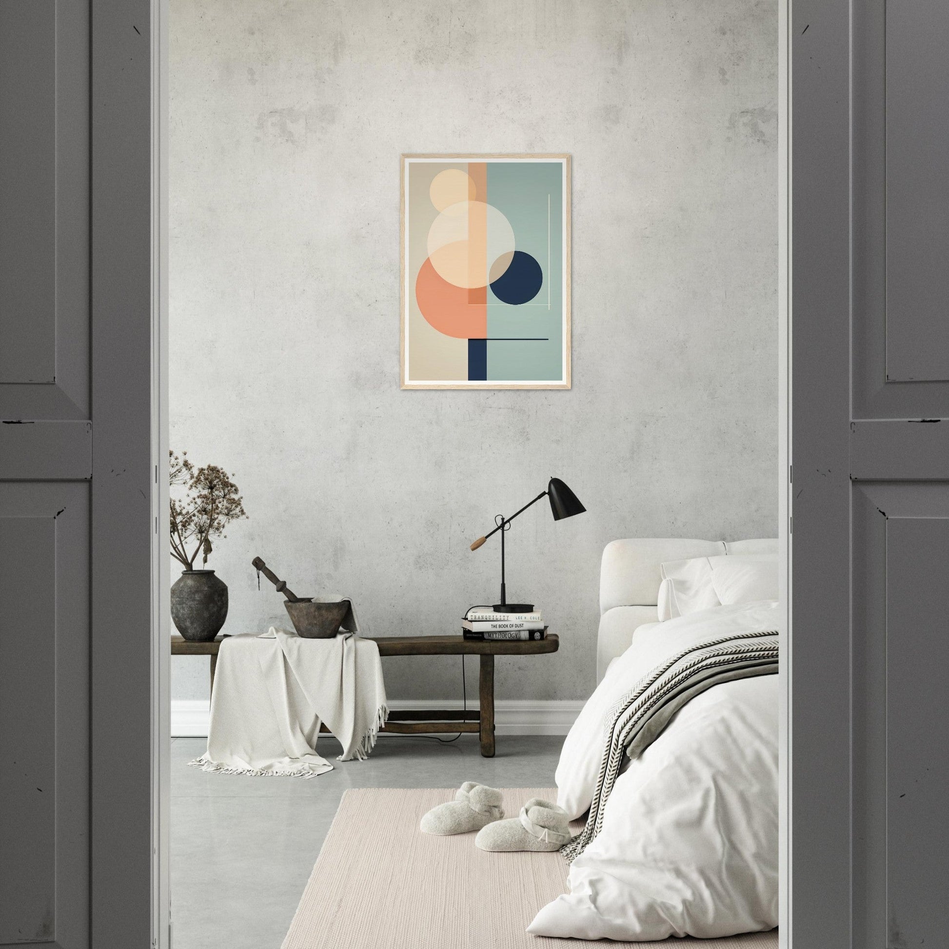 Minimalist bedroom with a geometric abstract artwork on the wall.