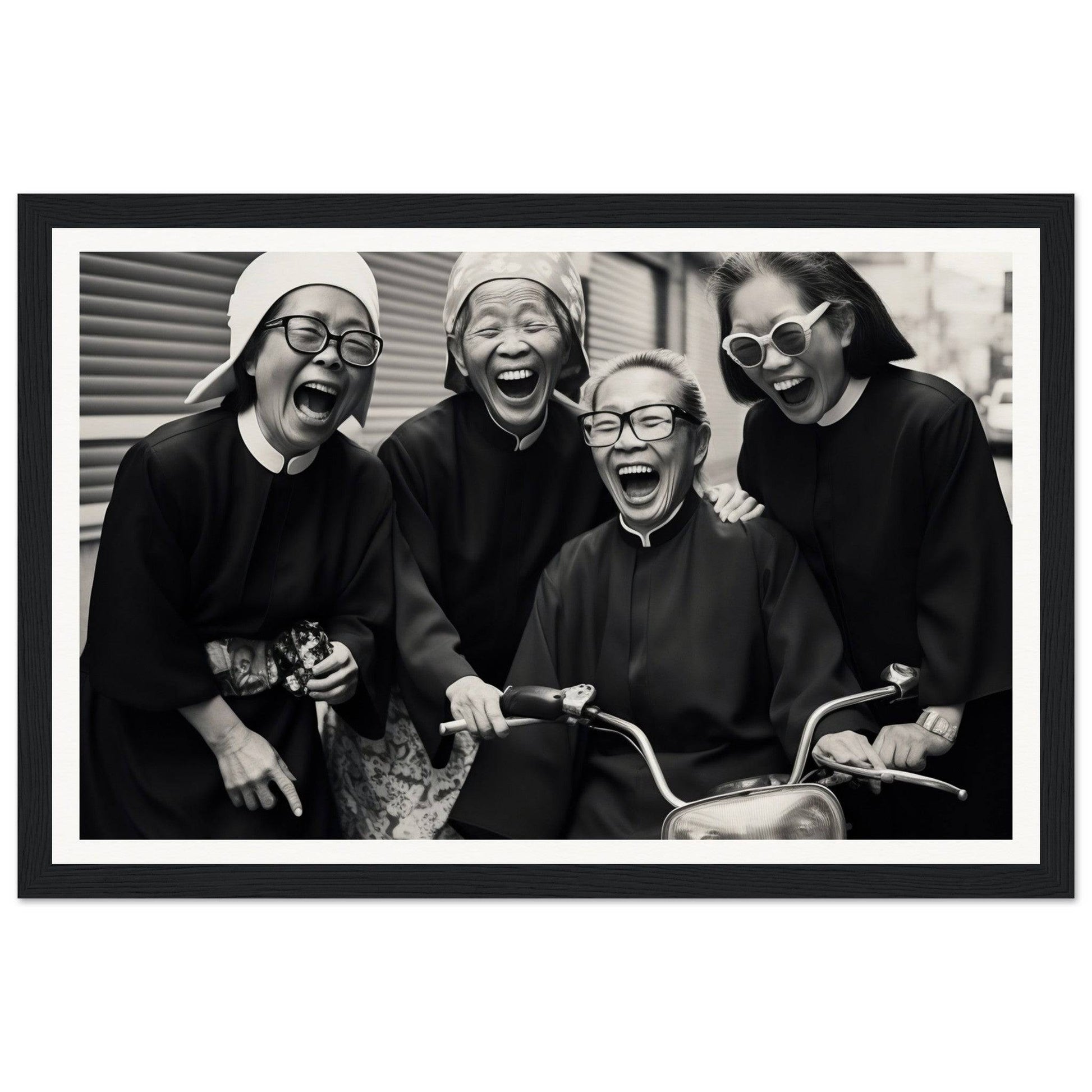 Black and white photograph of four laughing women wearing religious attire and glasses.