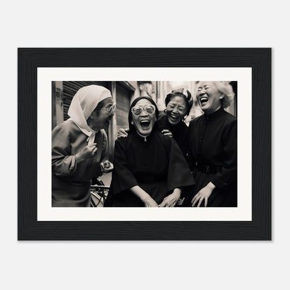 Black and white photograph of four women laughing together.