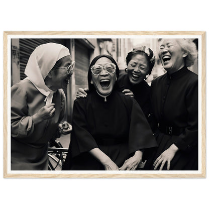 Black and white photograph of four women laughing joyfully together.