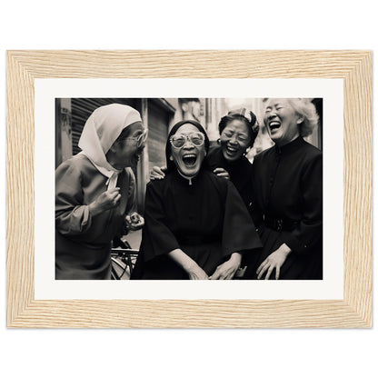 Framed black and white photograph of four women laughing together.