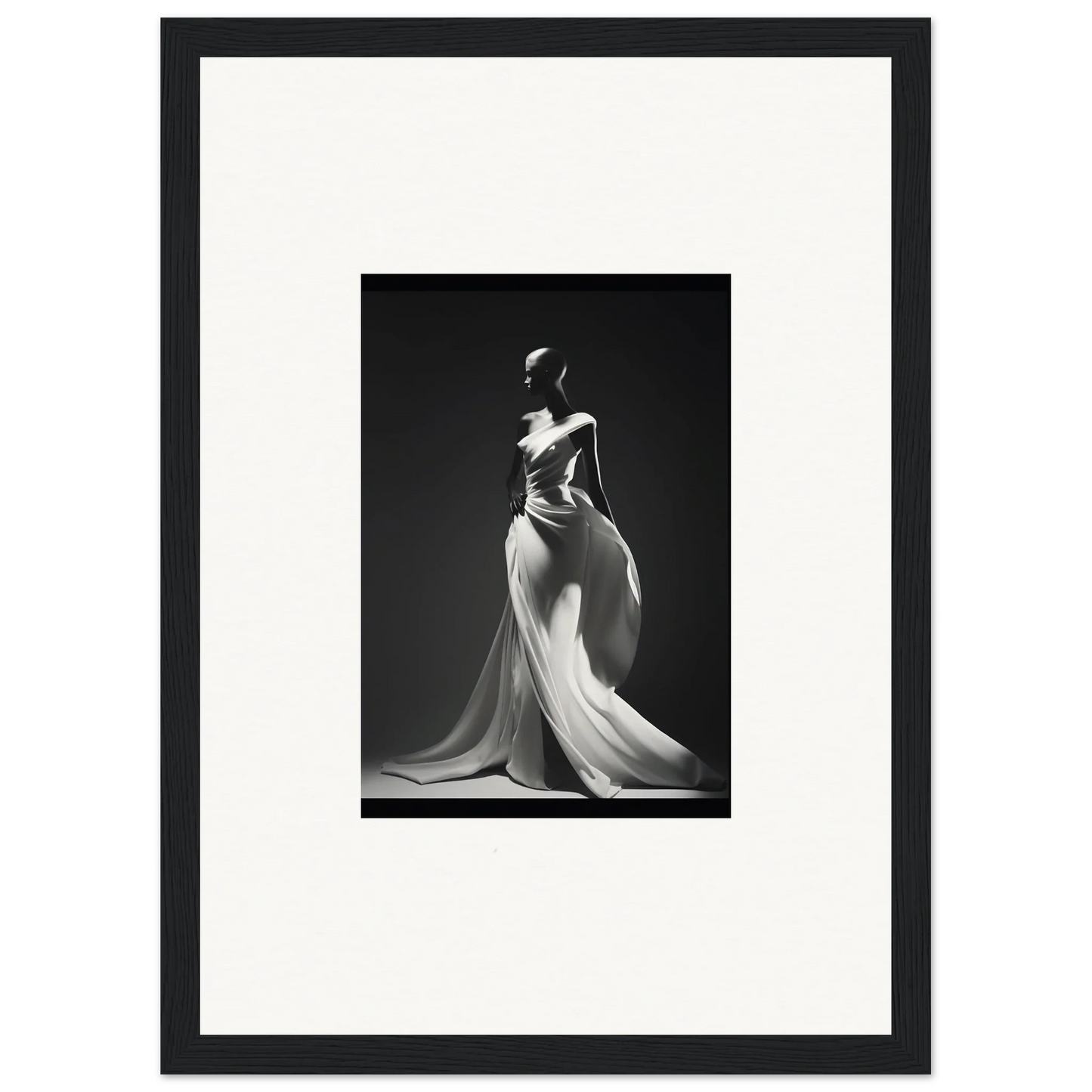 Black and white photo of Gossamer Ivory Whispers elegant evening gown with flowing fabric