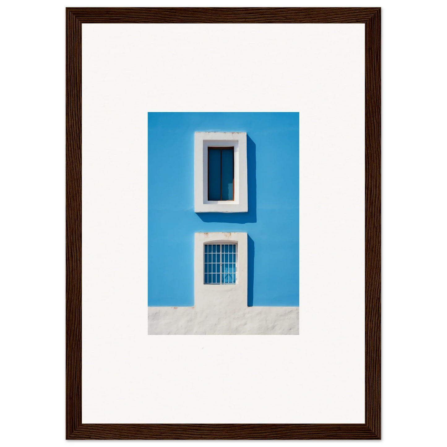 Framed wall art of Isles Encompassed Vista with bright blue wall and white trim