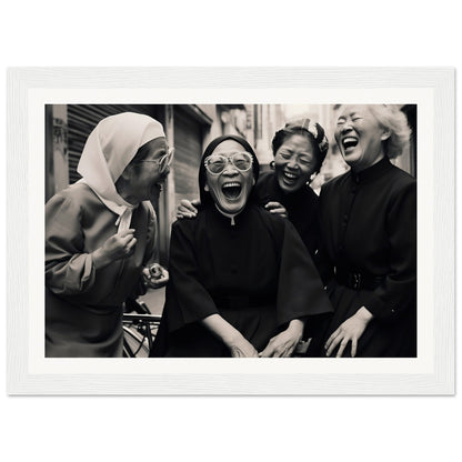 Black and white photograph of four women laughing together.