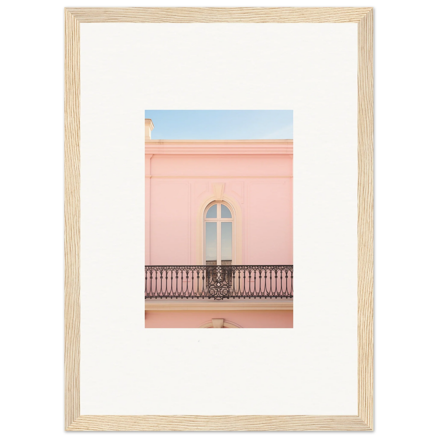 Framed wall art of a pink building balcony showcases the Peach Tranquil Portal vibe