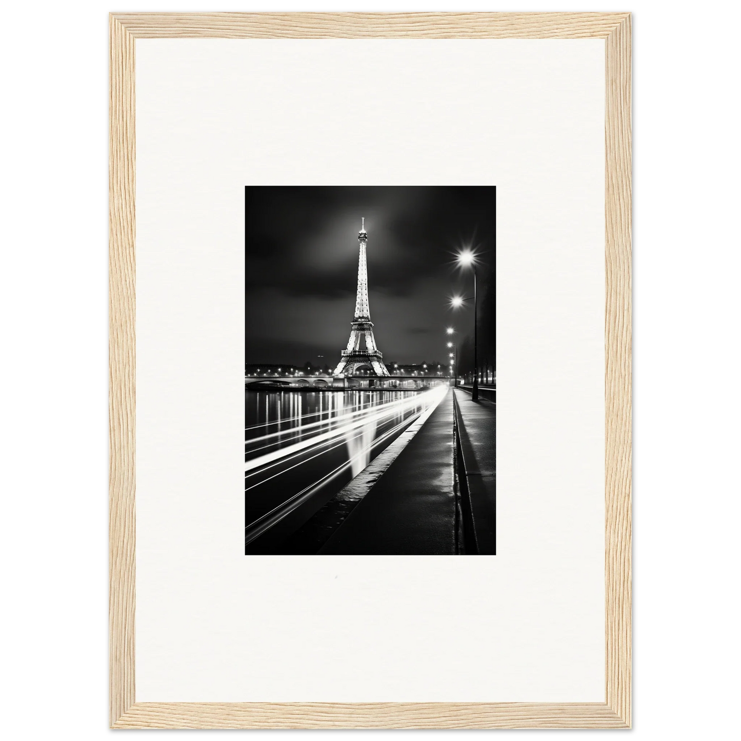 Black and white Eiffel Tower night photo in a light wood frame for premium framed wall art