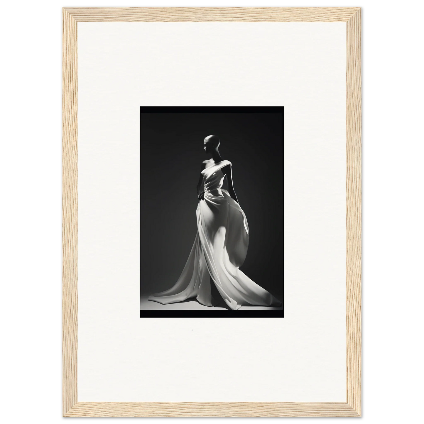 Elegant black and white photo of a figure in Gossamer Ivory Whispers gown