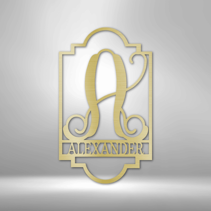 Ornate gold-colored monogram design featuring the letter ’A’ and the name ’Alexander’ in an elegant frame.