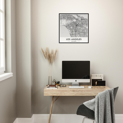 Minimalist wooden desk with a computer monitor and office accessories.