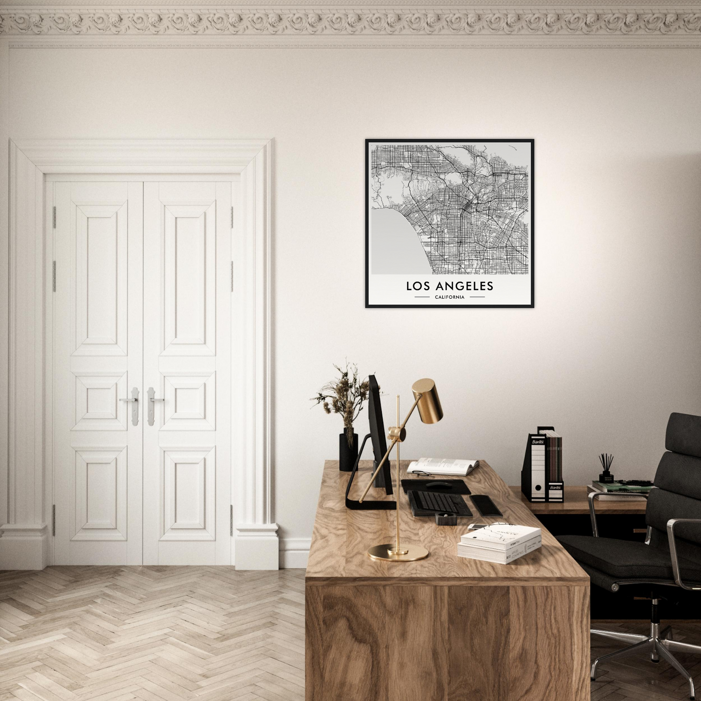 Wooden desk with a typewriter, books, and office supplies in a minimalist workspace.