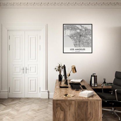 Wooden desk with a typewriter, books, and office supplies in a minimalist workspace.