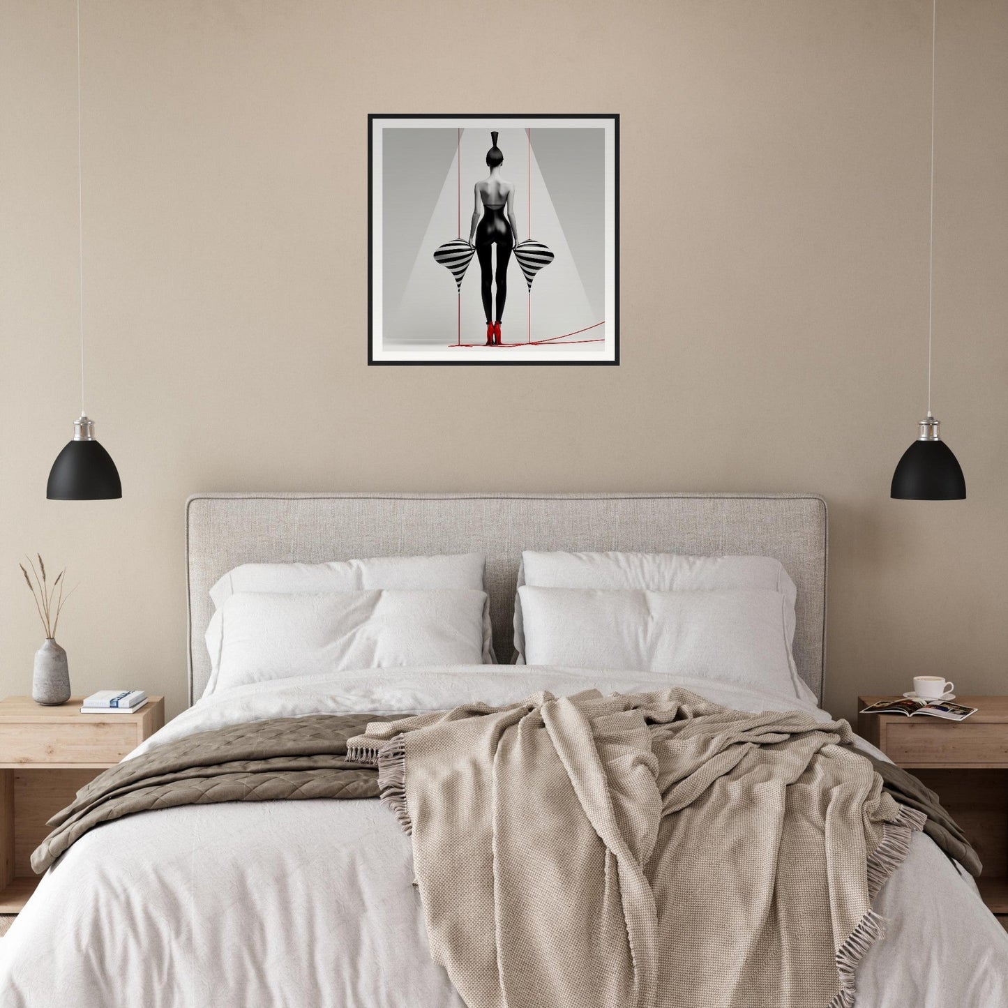 A bed with a white blanket and a black and white painting on the wall