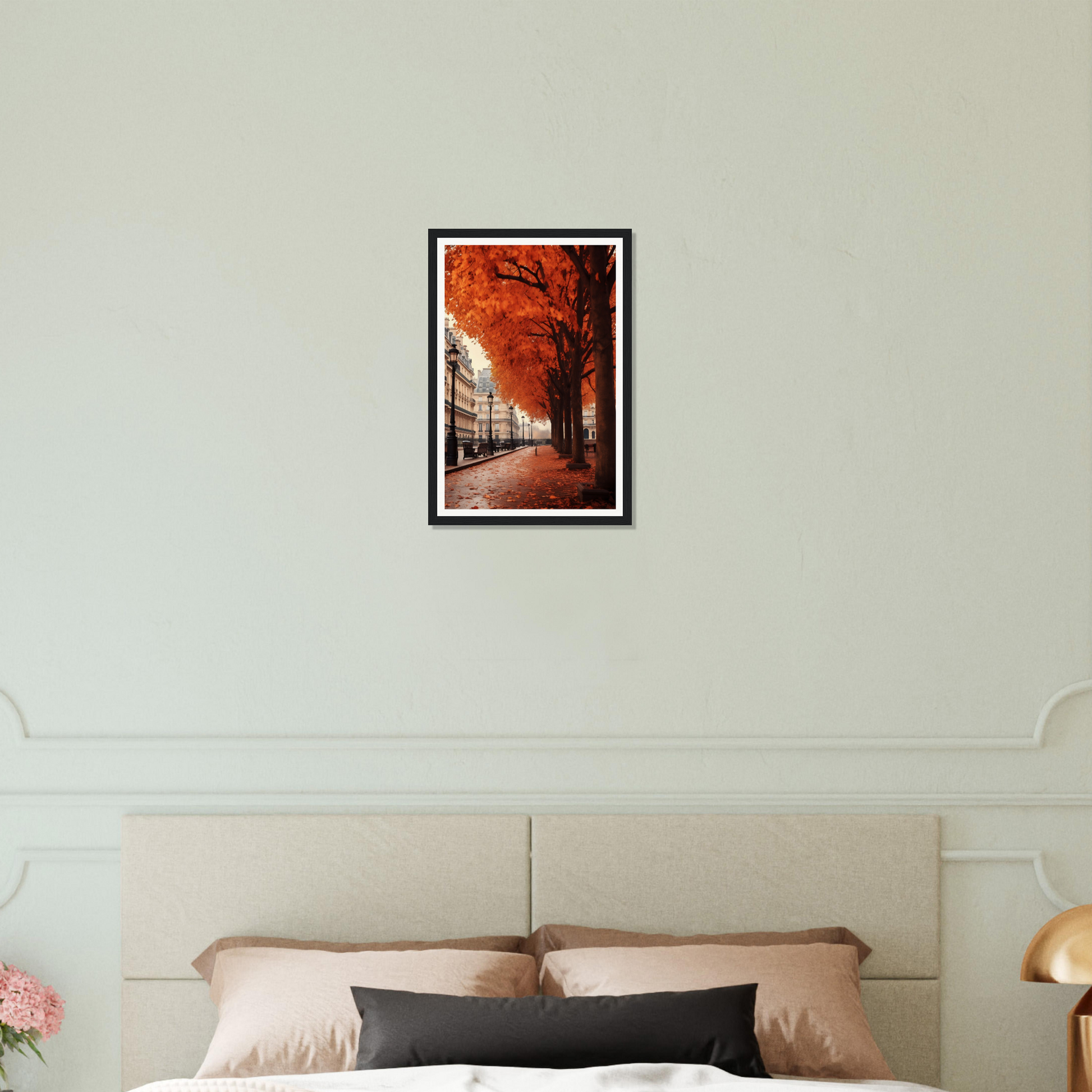 A bed with a white comforter and a picture of a tree