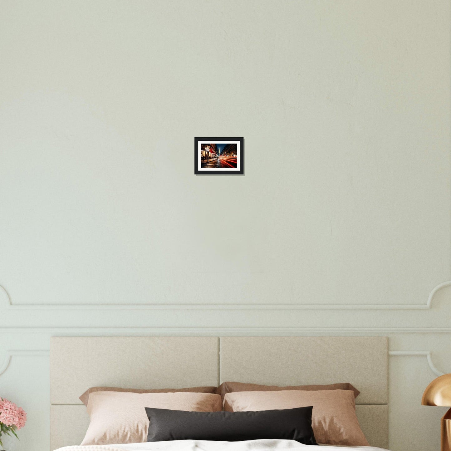 A bed with a white headboard and a pink pillow