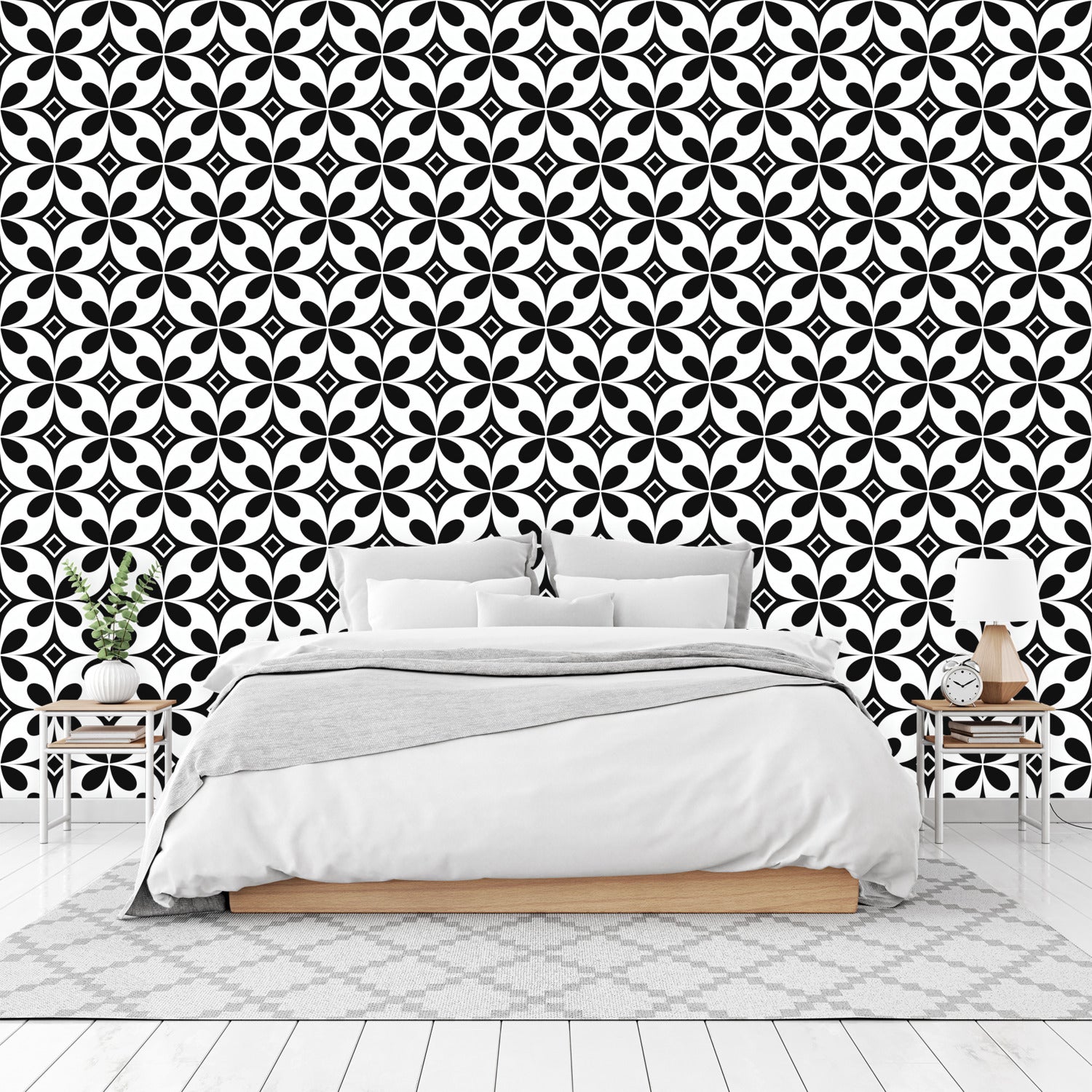 A bedroom with a black and white wallpaper