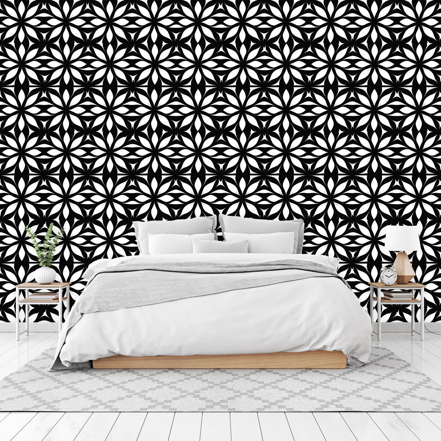 A bedroom with a black and white wallpaper