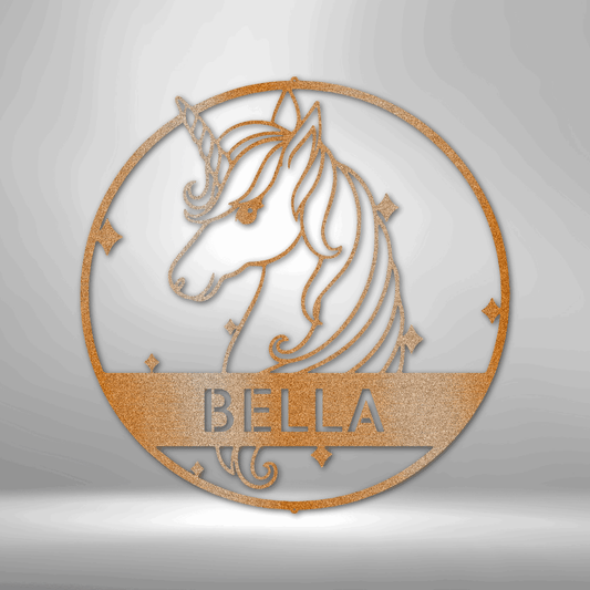 Circular wooden or metal wall decoration featuring a unicorn design and the name ’BELLA’.