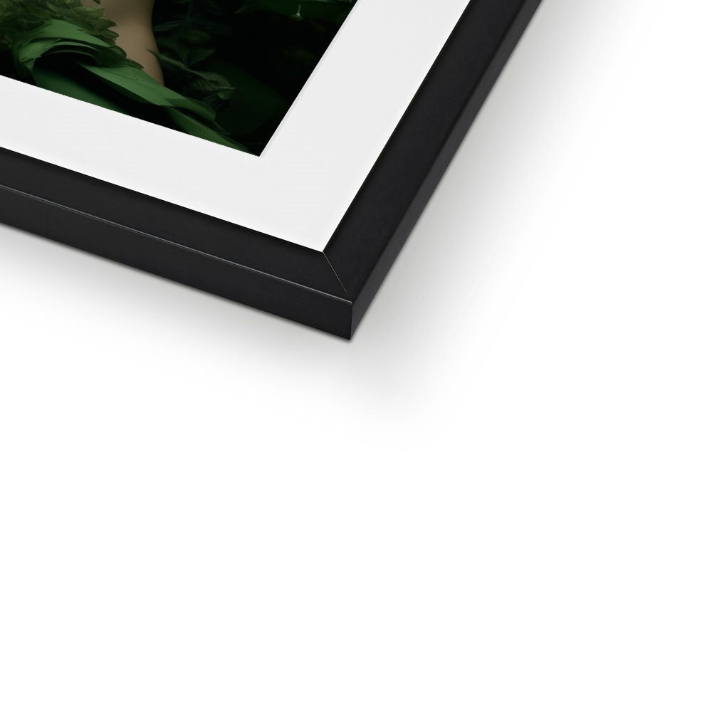 A black box with a white frame and a green leaf