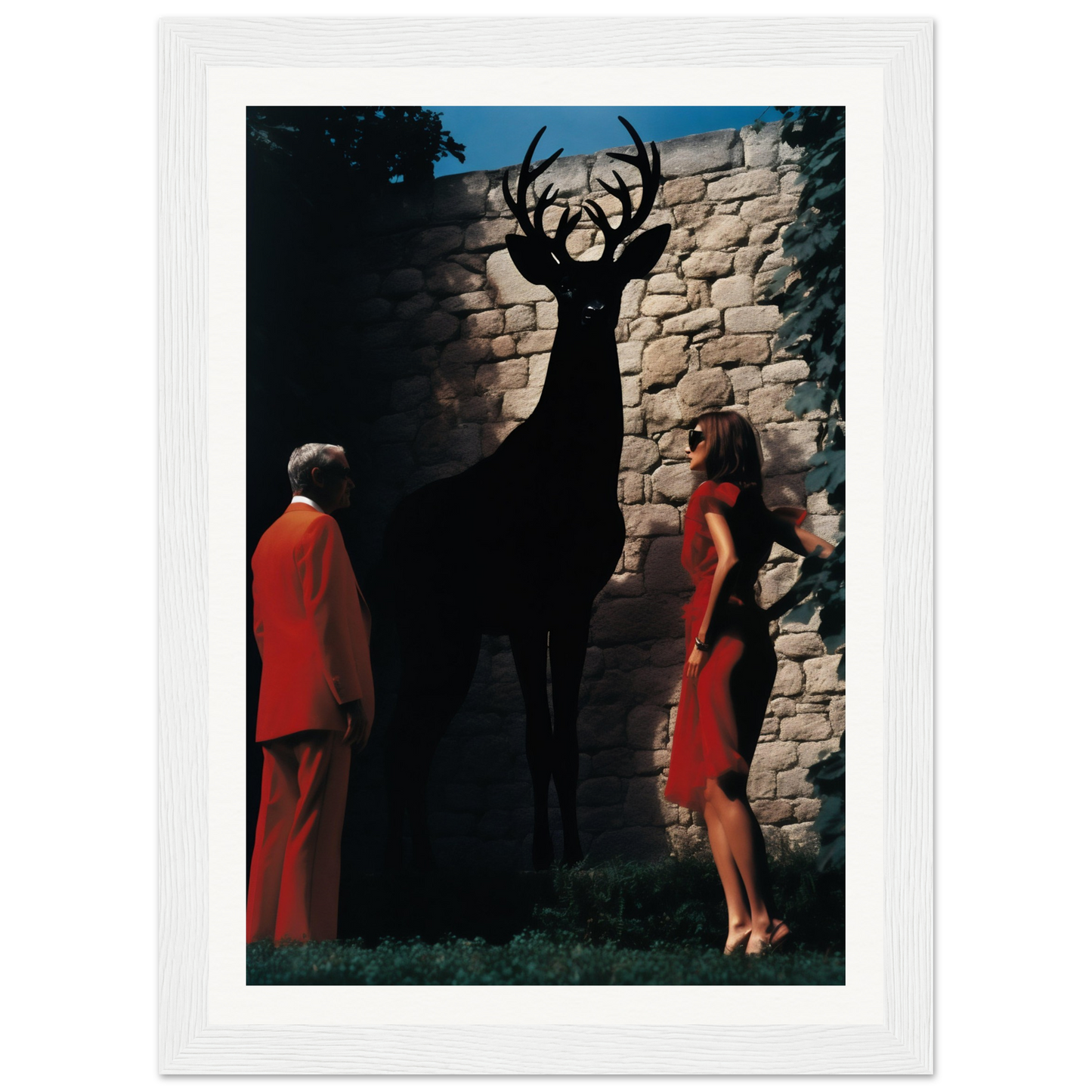 A black and white framed print of a deer and two women