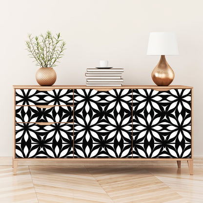 A black and white geometric pattern on a sideboard